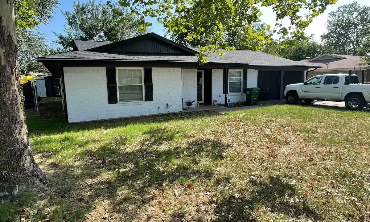 Professional roofing crew working on a residential roof in East Donegal